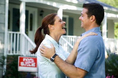 happy_couple_outside_sold_home.jpg
