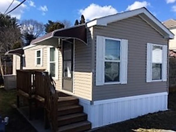Southcoast Community Mobile Home Park, a 55+ community, is comprised of 25 units. The park is quiet, well-maintained & professionally managed!  Located in the north end of NB with easy access to amenities!!! Unit #15 consists of 616 sq ft of living space offering an open kitchen/living room area, spacious bedroom w/double closet, bathroom has a walk-in shower! Appliances are included in the sale: frig, range, microwave, dw, stackable w/d! This welcoming mobile home is move-in ready (built in 2010). Other features include high ceilings w/ceiling fans, alarm system and storage shed! You deserve easy living in your Golden years...much more affordable than apartment living, independent from noisy tenants, maintenance free & low utilities! $440/month HOA covers water, sewer, real estate taxes, lawn maintenance, snow removal & trash removal. Assigned parking space located directly in front of your unit & additional visitor parking at rear of complex. Only service dogs are allowed.