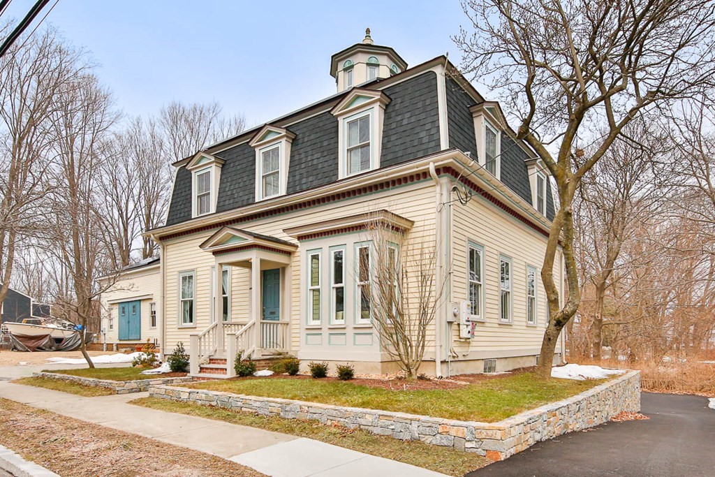 This lovingly restored turn-of-the-century home (with spectacular 3-level barn ) delivers the perfect balance of old and new! Faithfully and masterfully restored from basement to cupola by a renowned local builder in 2019, this 4BR beauty presents a lovely blend of modern and original design - with a french-inspired Mansard roof and oversized windows on the outside; and soaring ceilings, stunning crown mouldings, grand staircase, and original built-in cabinetry inside. Sunny stainless kitchen with pantry and central island, plus adjoining mud room. Custom designed baths. Gleaming hardwood floors throughout. Spacious attic with views of river through Cupola. Basement workshop. Sited on a spacious 1/2 acre lot with lovely perennial hedge and gardens. Central A/C and a 1-car garage, plus a 3-story barn that's already plumbed and heated, providing extra space for favorite hobbies, a teen-hangout, or potential for more finished space for guests or inlaws.