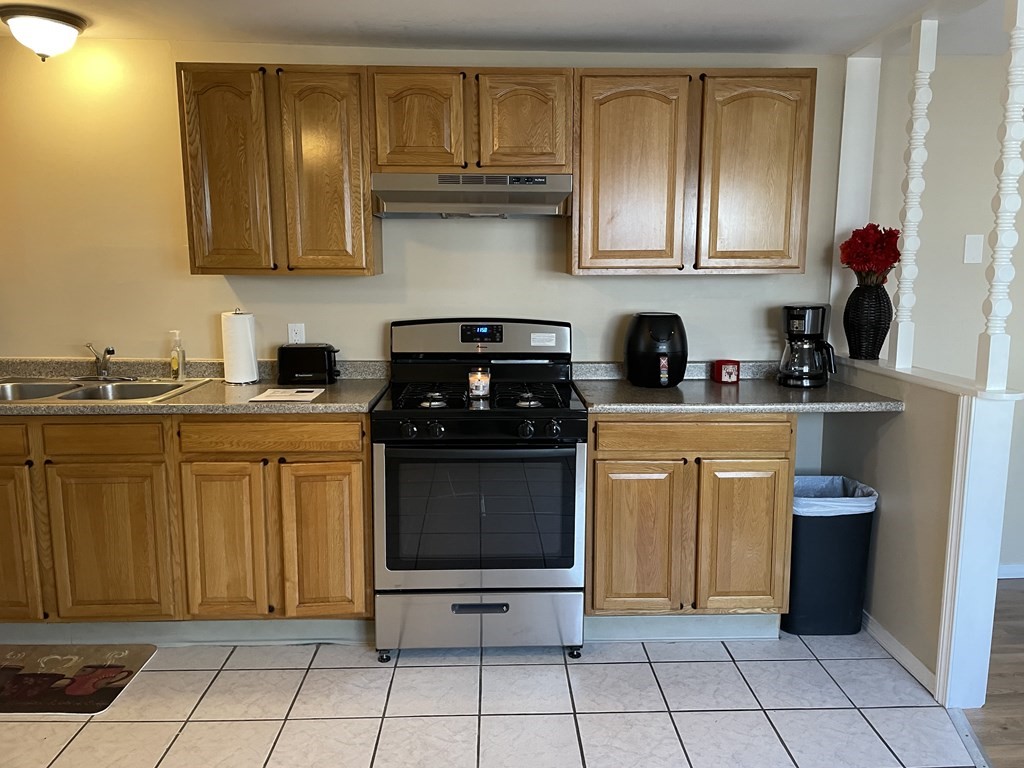 THIS IS THE LOWEST PRICED TOWNHOUSE ON THE MARKET IN FALL RIVER AND THE ONLY ONE OFFERING CONDO FEES  TO BE PAID IN FULL FOR ALL OF 2022! WHY PAY RENT WHEN YOU CAN OWN THIS 2 BEDROOM 1 BATH END UNIT TOWNHOUSE?! CONDO FEATURES AN OPEN FLOOR PLAN, 2 LARGE OFF ST. PARKING SPOTS, NEW STAINLESS- STEEL APPLIANCES, NEW HOT WATER HEATER & A  GOOD SIZE DECK THAT CAN FIT A GRILL. NEW FLOORING WAS DONE IN  THE LIVING ROOM & BOTH BEDROOMS HAVE  CATHEDRAL CEILINGS. BRAND NEW ROOF WAS JUST FINISHED THE FIRST WEEK OF JANUARY. NOTHING LEFT TO DO BUT MOVE IN, THIS CONDO IS PERFECT FOR A FIRST TIME BUYER OR ANYONE WITH A COMMUTE. (CLOSE TO THE HIGHWAY) *COIN OP LAUNDRY ROOM AVAILABLE IN SHARED BASEMENT AREA