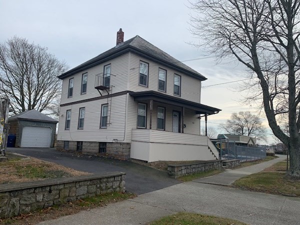 2 Family in New Bedford's West End with 1 car garage, large driveway & enclosed yard. Has been used as 2 bedroom apartments although assessor's has it as 1 bedroom.  Small building on property that has many possibilities, but can not have access to interior. Will not qualify conventional due to small boarded up building. Cash or hard lending.