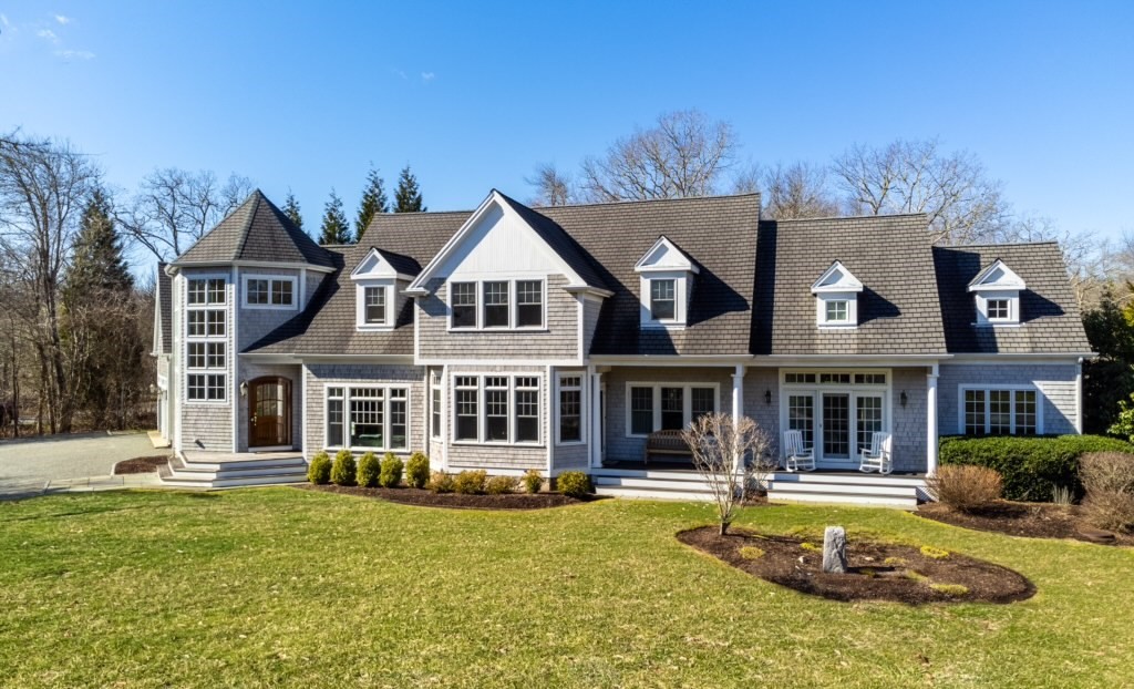 This striking shingled Colonial residence, nestled on a 2.35 acre lot, is mere steps from the manicured 9 hole golf course for which Round Hill is widely known. The home's grand foyer leads to a gracious floor plan to include a fireplaced living room, gourmet kitchen, dining room, master bedroom w/ ensuite bath & heated floors and a sun drenched loggia overlooking the heated inground pool w/ electric cover and outdoor living space. A half bath & laundry room complete this level.  The second floor features a central family room/library and 3 additional bedrooms each with an ensuite bath & walk-in closet.  Among the home's many amenities and architectural details is an attached oversized 2 car garage, whole house generator & sound system. Community amenities include 2 sandy beaches, Olympic size swimming pool, club house, tennis courts, seasonal cafe, and children's playground. Simply put, this is a one of a kind offering in one of South Dartmouth's premier seaside communities