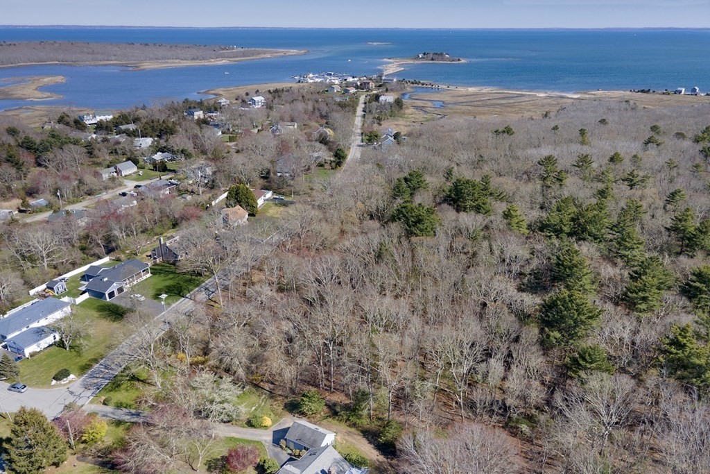 Building lot in the coastal community of Mattapoisett, located approximately 1/10 of a mile from the shores of Buzzards Bay. This lot has deeded rights to the Leisure Shores Beach Association. Dues are annual.   Engineering in place including wetlands, flood mapping, septic design and approval for a 4 Bedroom house, well location/testing, wetlands replication approval, topographical, and building area envelope.